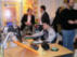 Visitatore prova un ausilio in uno stand dell'area espositiva